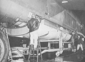 Recce capsule being winched into the bomb bay of an RB-52B