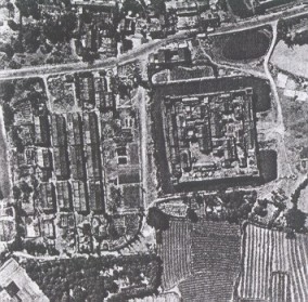 A photo taken by Edward Powles over Hainan Island showing a walled and moated settlement